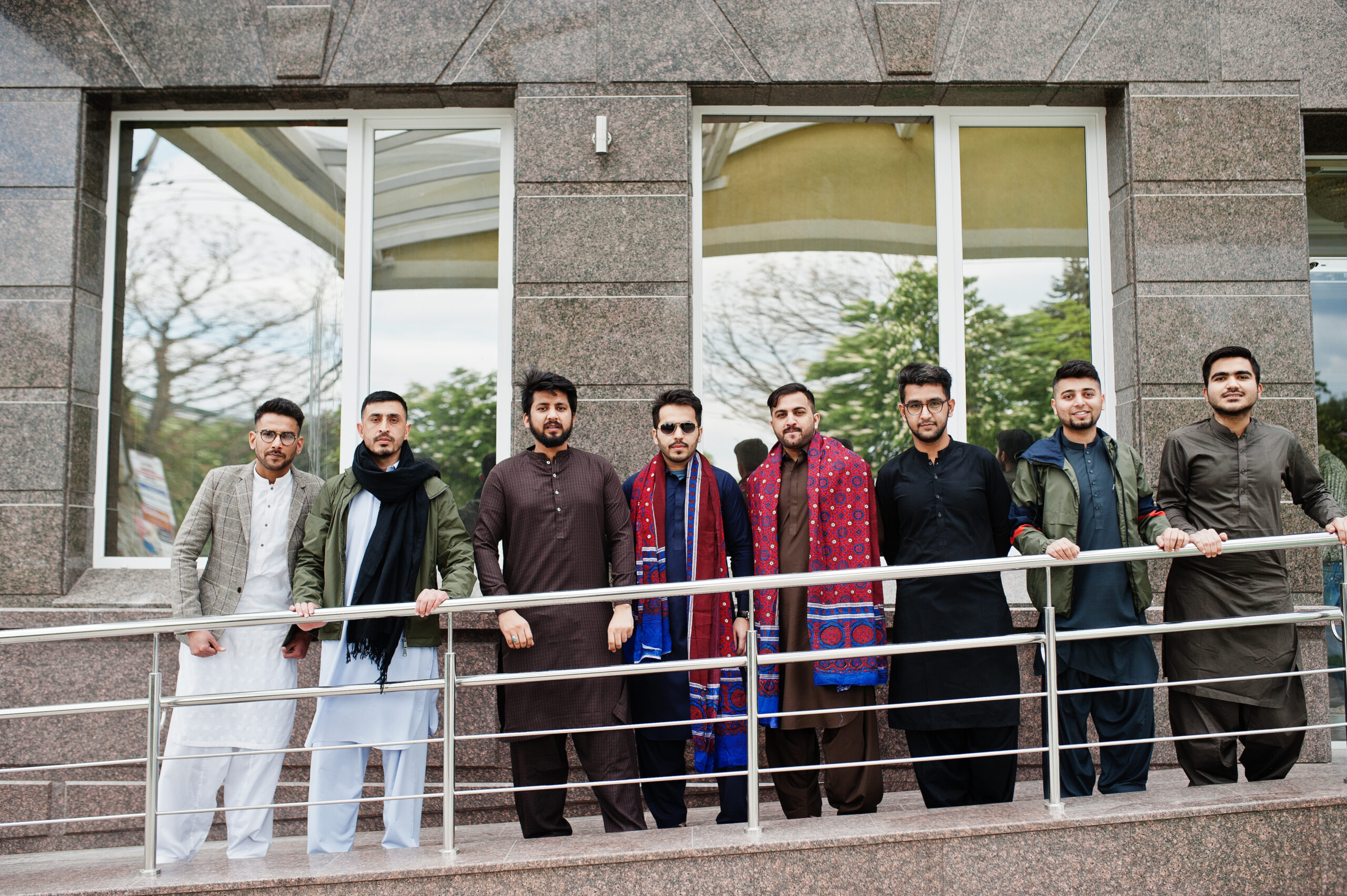 Group of pakistani man wearing traditional clothes salwar kameez or kurta.