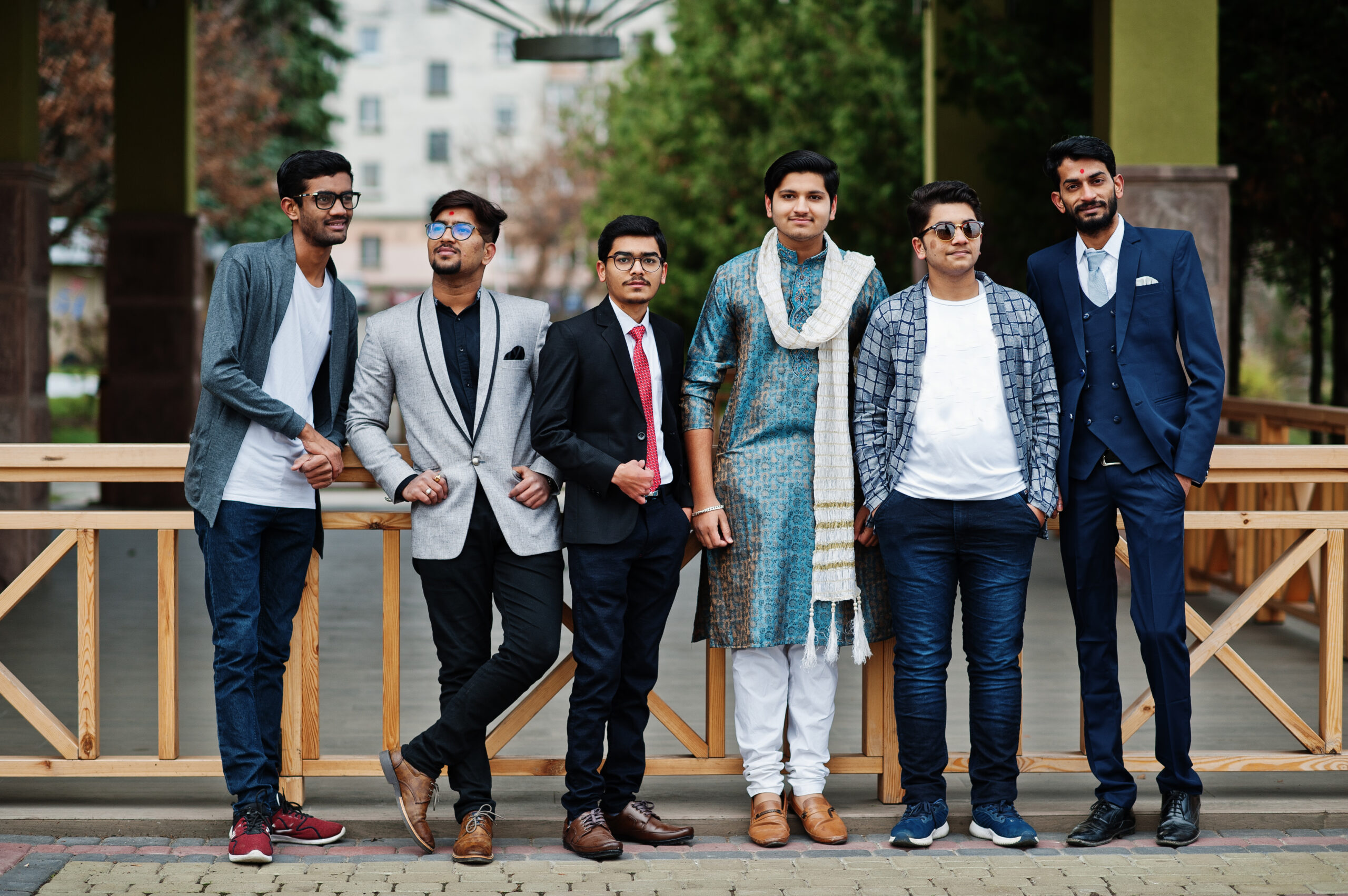 Group of six south asian indian mans in traditional, casual and business wear.